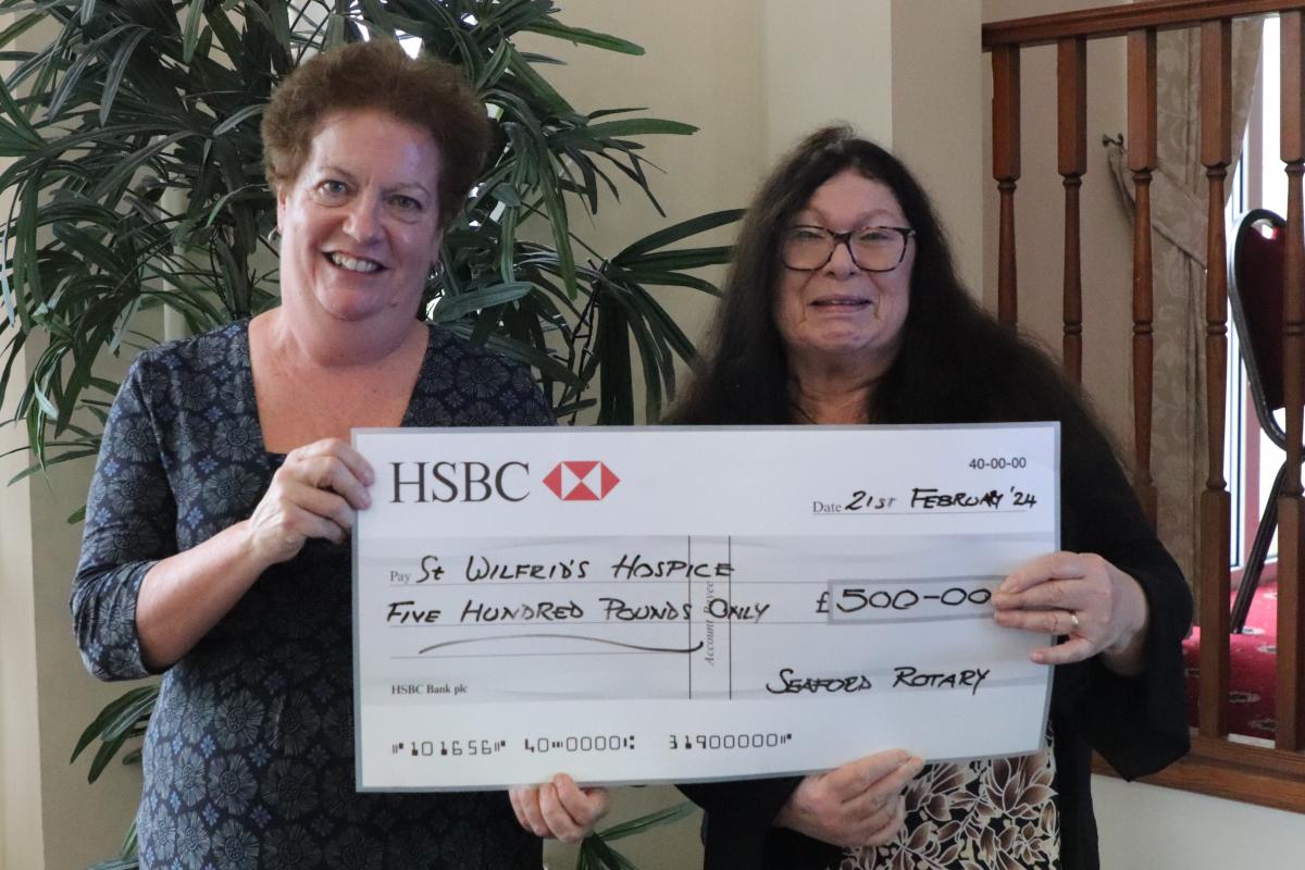 Pam Russell, Development Director, St Wilfred’s Hospice receiving the donation cheque from President Mandy Davis