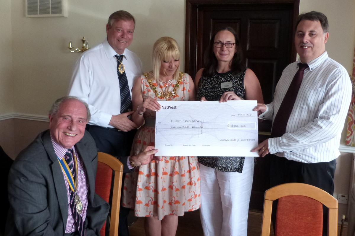 President John presents a cheque for £500 to Kevin of Shiloh Rotherham, assisted by the Mayor and VP Liz.