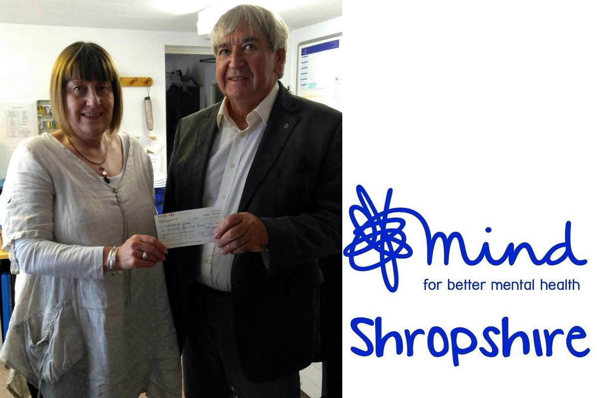 Manager Heather Ireland receives a cheque for £150 from the recent Street Collection.
