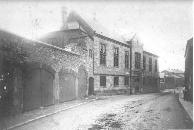 Denbigh butter and cheese market.  Built in 1846-7 it was demolished, apart from the ground floor, in the early 20th century.  It is now part of Denbigh College.
