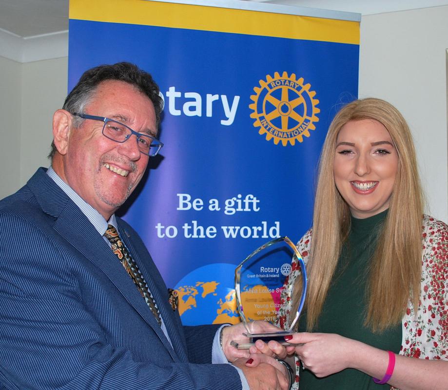 Anna is pictured receiving her Young Citizen of the Year award from then District Governor Terry Long.