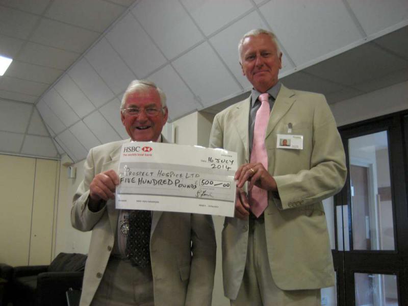 John Hicks hands over a cheque for £500 to John Fowler, Fundraising Ambassador for Prospect Hospice.
