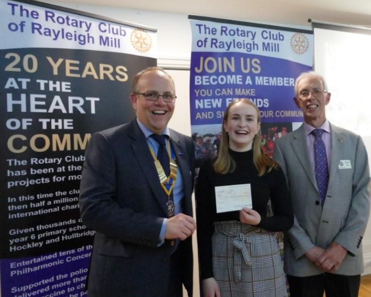 Katie is presented with a cheque by President Rtn. Carl Watson and International Committee Chairman, Rtn. Roger Allen