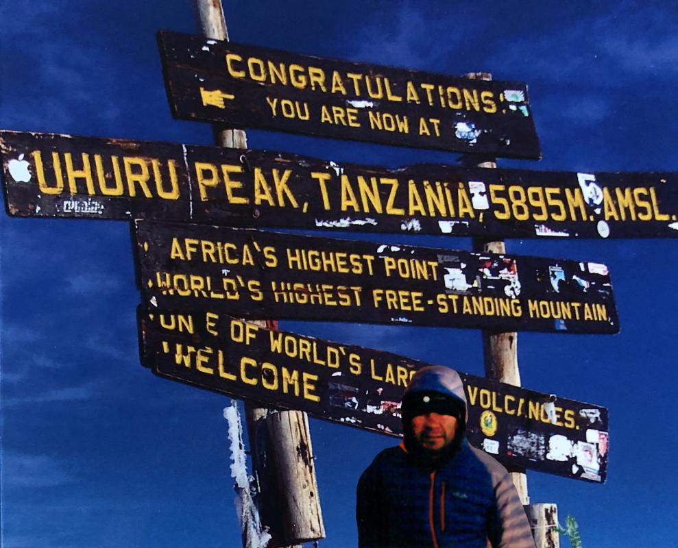 Standing at the Summit of Mount Kilimanjaro