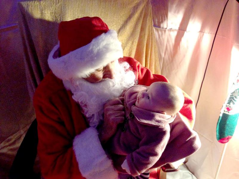 Santa with a new friend in his grotto