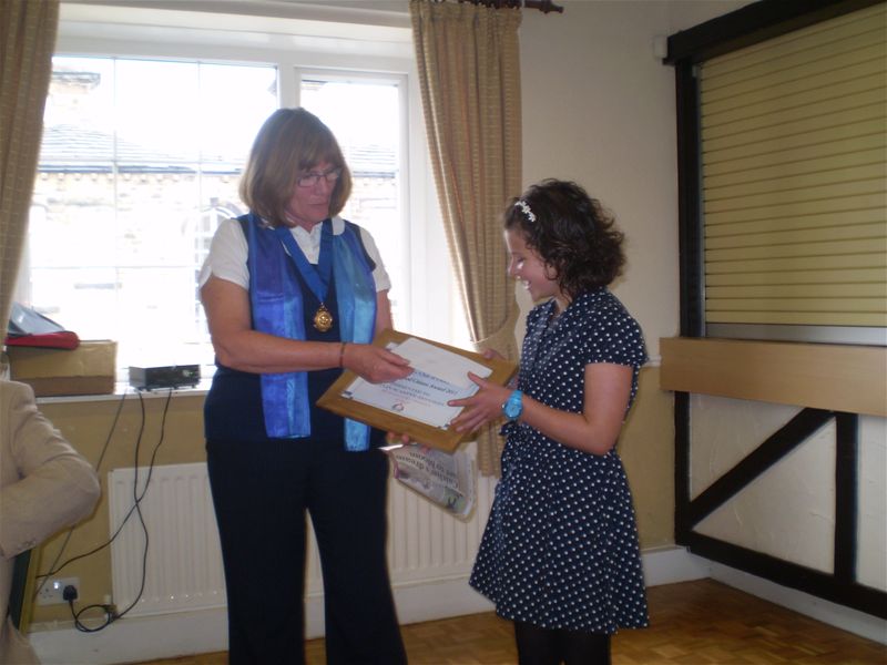 Immediate Past President Brenda Wood presents Caitlin with her award at the Club's lunchtime meeting on Tuesday 16-Aug 2011