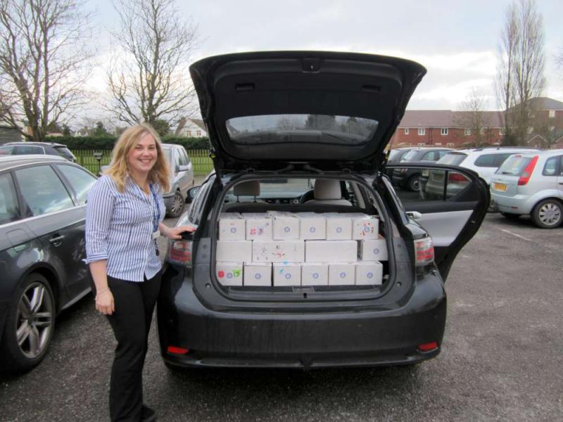 Miss Wallace, the Deputy Head - assisted by a number of children helped to pack more than 100 shoeboxes!