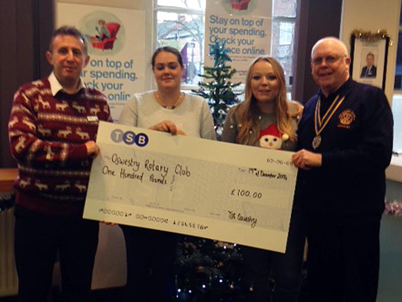 President David receives the cheque from manager Chris White and staff of the TSB Oswestry