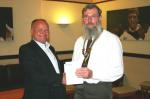 Brian Hewett presents a cheque to Onchan Rotary Club President