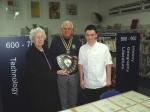 Grace Morris and President Derek present the Bill Morris Memorial Shield to Matthew Bell