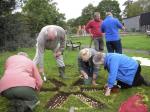 Chairman, Rodney, President Ian and members and partners planting the Crocuses in the Sensory Garden at the OAKWOOD Centre, Woodley.