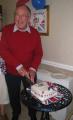 President Mike Berry cuts the Diamond Jubilee celebration cake.