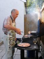 Malcolm concentrates on producing perfect burgers!