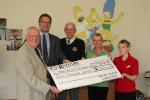 Katrina and her colleagues receive the cheque.