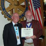 President Philip receives a "birthday card" from District Governor Ken Boylett.