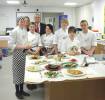 Young Chefs with teachers and the dishes they've produced