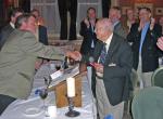 Harry Hewitson being inducted by President John Neale