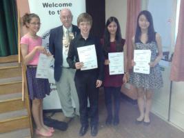 Young musicians receive their prizes from club President, Dave Fenwick. 