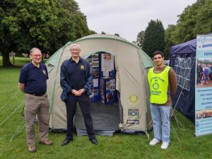 Three random chaps outside a Shelterbox tent in Midsummer Meadow.
