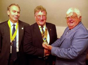 Derek Lloyd hands over to Ron Ansell with John Benbow, the new Vice President