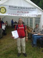Ashok Harshey at the end of his walk across Wales