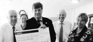 Penzance Rotary President Matt Martens presents funds to Pengarth Trustee Eric Parton.