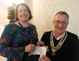 President Brian presents a cheque to 
