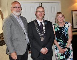 Photograph (a) L-R Keith Shedden (vice president) Michael Keene (president) and Liz Baxter (outgoing president)
