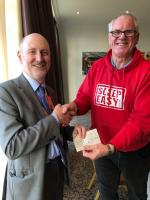 President Mike presents Hope For Justice's Alan Burley with a Rotary cheque