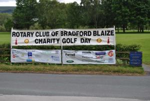 The Ilkley course in the background with details of our sponsors and the local charities that we help in the foreground