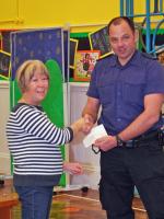 Jenny Hynan of Swanage Rotary presents a cheque to Barry Ashdown