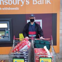 Matlock Rotary's John Bent with the Food Purchased from Sainsbury's for the Hampers