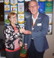 President Colin Dowding presenting Margaret Butt with her purple crocus