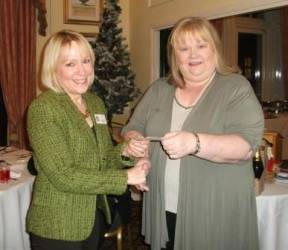 Past President Tess presents Pam with a cheque for £750