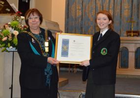 District Governor, Cath Chorley presents the Certificate to Interact President Rebecca Johnson.
