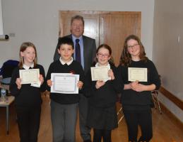 Master of Ceremonies, Peter Hill with the winning team from Bridge of Allan Primary School.