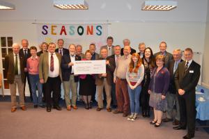 Rotary club members with Strathcarron Chief Executive Irene McKie (centre) accepting cheque from President Colin Strachan (left) and Hospice Support chair, Jim Gardner (right). Billy Andrew and Marjory Mackay are last and 3rd on right respectively.
