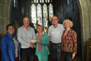 Pictured here with a cheque for £2,304 which was raised in aid of Cancer Research UK are Susie Barton, Rotarian Vic Clarke, Kay (Richard’s wife), Barry Day and Clare Macourt.