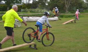 A local expert deftly navigating the Cyclofun bicycle assault course!