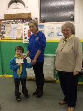 Rowan Stephenson receives a cheque for Â£200 towards new camping equipment for the 1st Royal Wootton Bassett Scouts.