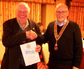 President John presents Dr Gwyn with his certificate to mark 40 years as member of The Rotary Club Of Denbigh