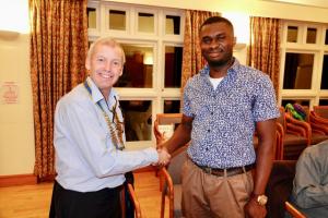 President Tim Cox welcomes Ezekiel to Watford Rotary Club