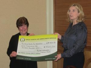 DG Fiona Swan presents the cheque on behalf of the clubs taking part.