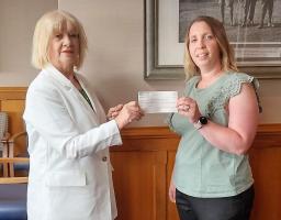 cheque to Michelle Strong