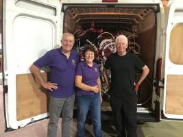 Rotarians Bob Taylor and Jackie Wellman and a volunteer from the Re~Cycle charity with another successful collection of donated bikes