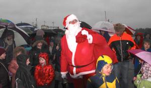 Fine figure of Santa lifts the weather gloom..