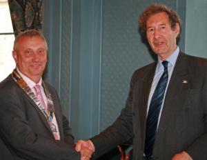 Mike Lang handing over the president's chain to David Ellis