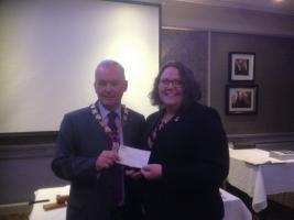 Heather McVey receives a cheque for the Transplant Games
