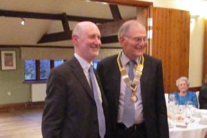 Past President Mike hands over to President Chris