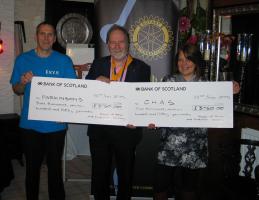 Picture shows John Lange representing Parkinson's UK and Alison Rennie from CHAS receiving their cheques from President Elect Colin Strachan.